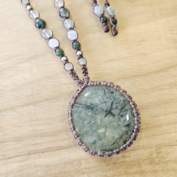 Prehnite crystal pendant necklace wrapped in matte brown coloured cord